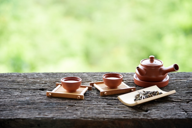 Chinese tea set oriental drink style on Natural green