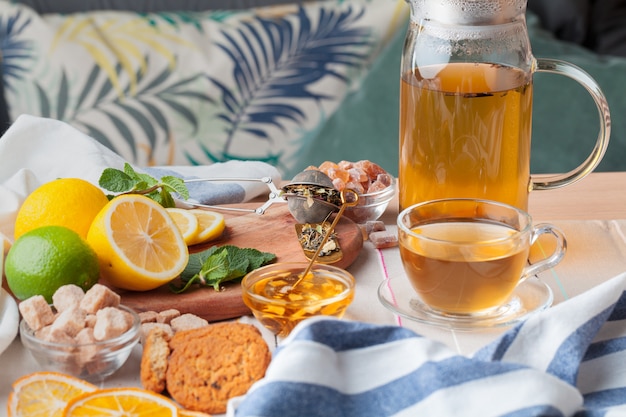 Chinese tea teapot lemon ginger honey on light tablecloth. Tea ceremony