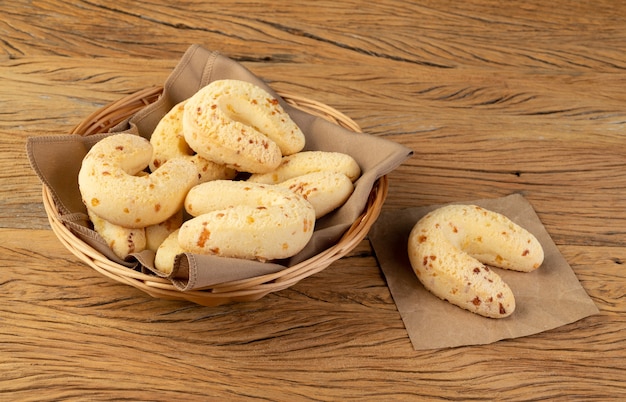 Chipas, typical south american cheese bun over wooden table.