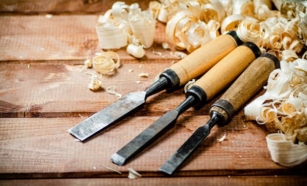 Photo chisel with a bunch of wood sawdust