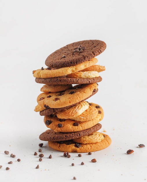 Chocolate american cookies with chocolate chips and raisins on white wooden table Top view flat lay