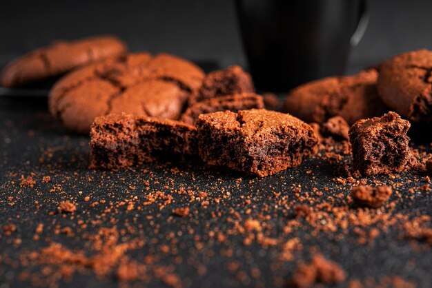 Chocolate Americano cookies on dark background. Broken cookies. High quality photo