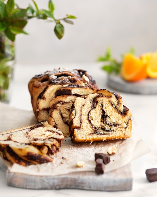 Chocolate Babka with oranges Orange pastries on a marble table Homemade cake Brooklyn cuisine Chocol