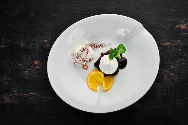 Chocolate Baking with Ice Cream Brownies On a wooden background Top view Free copy space