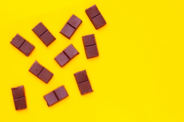 Chocolate bar isolated on yellow surface