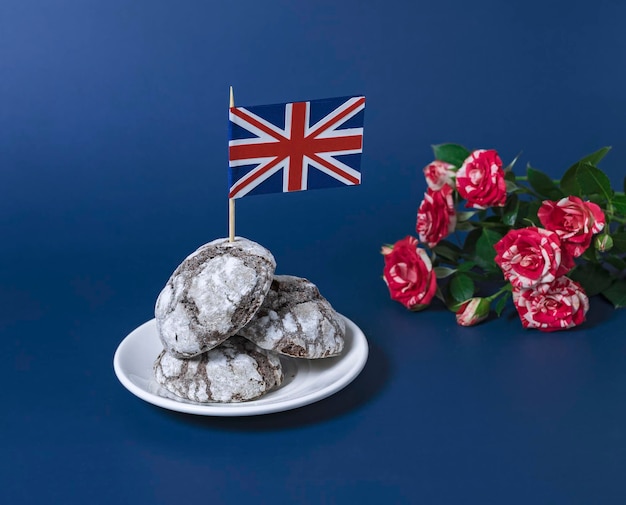 Chocolate Brownie Cookies with british flag bouquet of roses out of focus on background