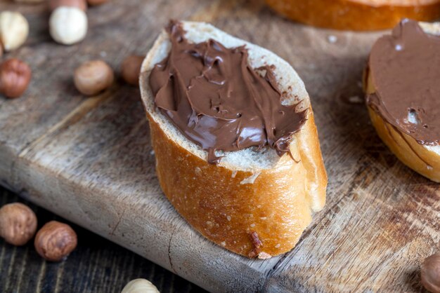 Chocolate butter spread on a baguette close up