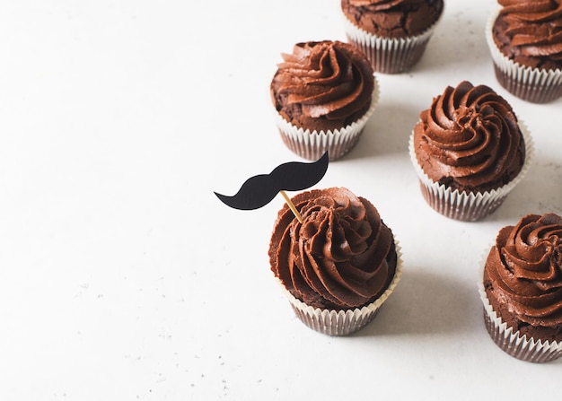 Chocolate cacao cupcakes with moustache fathers day concept