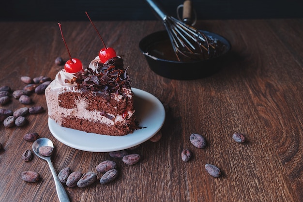 Chocolate cake and cocoa beans for making chocolate