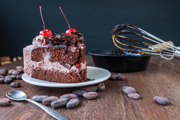 Chocolate cake and cocoa beans for making chocolate