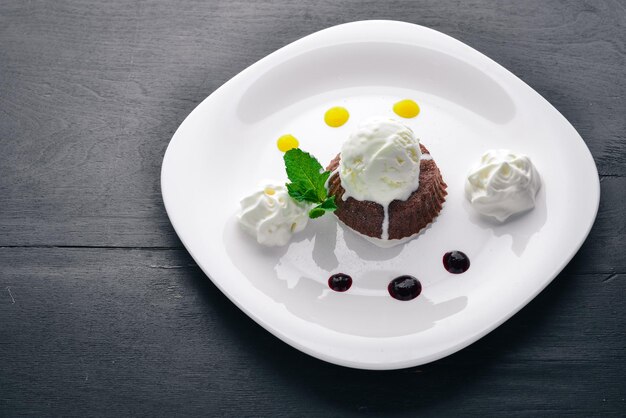 Chocolate Cake Dessert with Ice Cream On a wooden background Top view Free space for your text