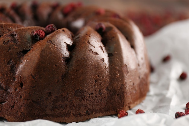 Chocolate cake on paper closeup