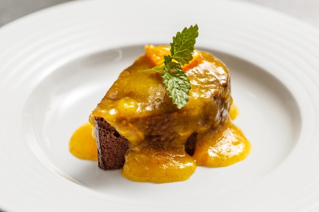 Chocolate cake with orange sauce