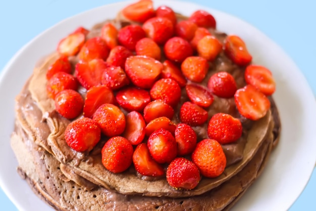 Chocolate cake with strawberries. Homemade pastry.