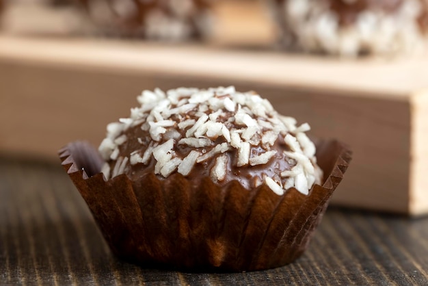 Chocolate candies with coconut flavor and filling sweet chocolate candies with cocoa