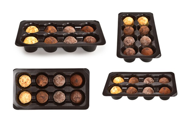 Chocolate candy collection in plastic box.