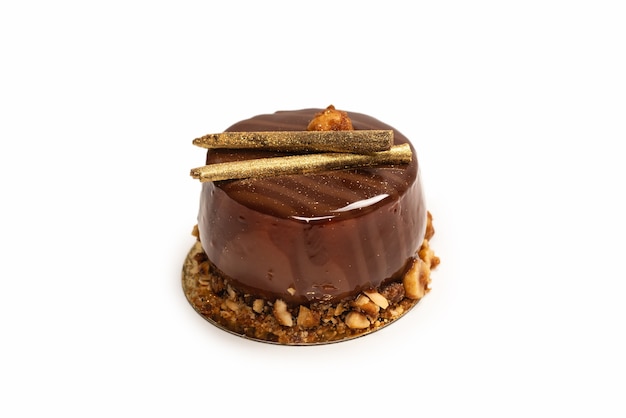 Chocolate and caramel cake isolated on a white surface