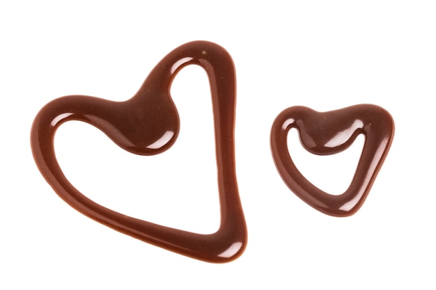 Chocolate caramel sauce heart shape on a plain white backround