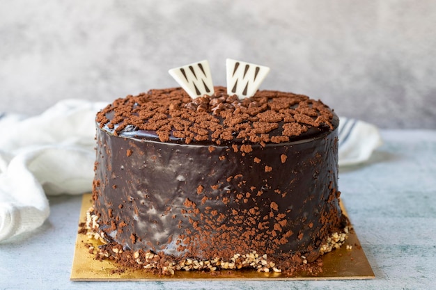 Chocolate celebration cake Birthday cake on gray background close up