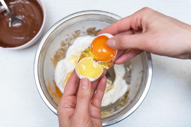 Chocolate chip cookie ingredients background fresh eggs flour baking chocolate top view copy space