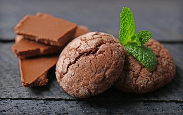 Chocolate chip cookie with chocolate pieces and mint closeup