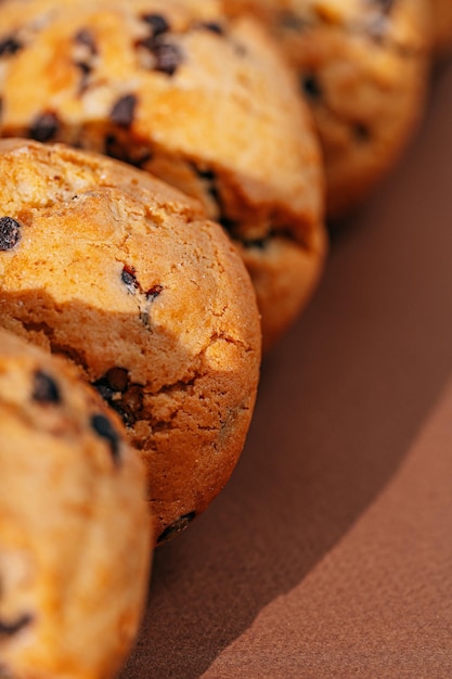 Chocolate chip cookies closeup on brown background