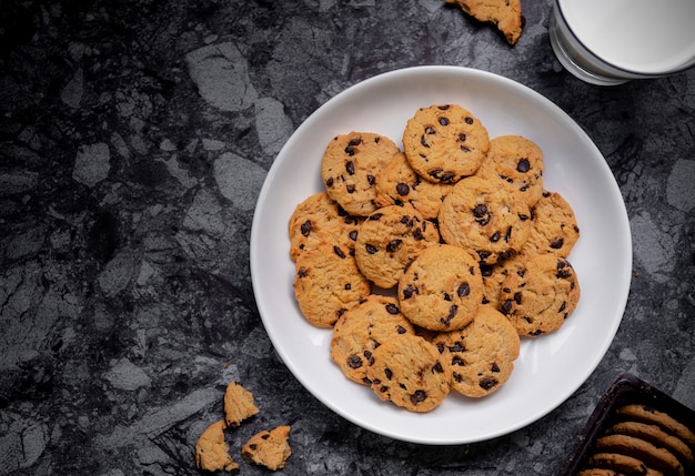 Chocolate chip cookies with milk on top view