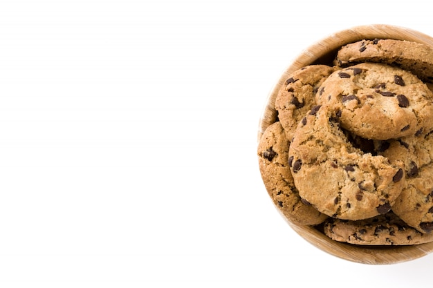 Chocolate chip cookies in wooden bowl isolated on white