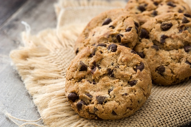 Chocolate chip cookies on wooden table close up