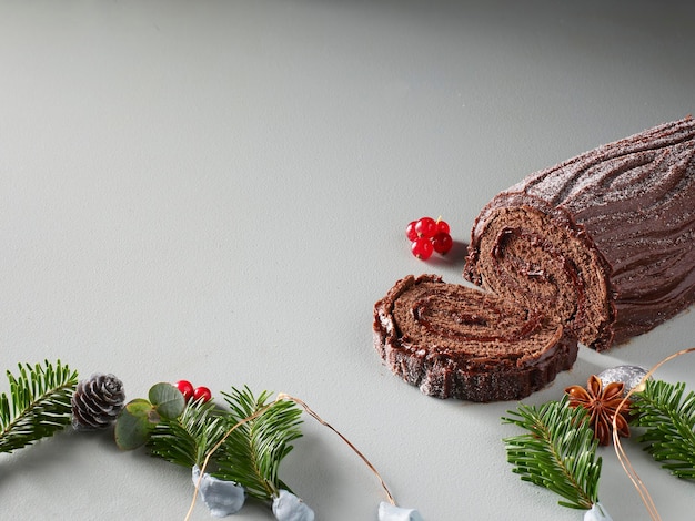 Chocolate Christmas Cake Decorated with Figs Grapes Walnuts and Rosemary copy space for your text