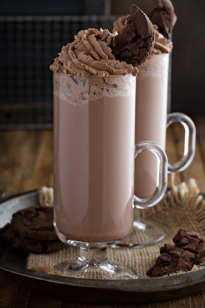 Chocolate cookie milkshake in tall mugs