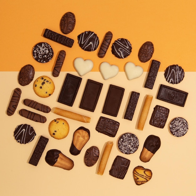 Chocolate cookies mix background Sweets choco lover design Minimal art Holidays time winter christmas celebration flat lay