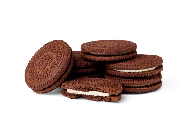 Chocolate cookies with milk filling isolated on white background.