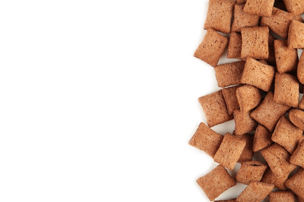 Chocolate corn pads isolated on white background. Cereals. Top view