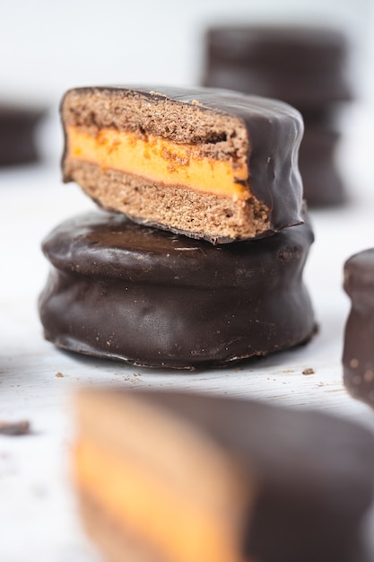 Chocolate covered cookies with orange cream filling