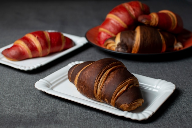 Chocolate croissants on plates