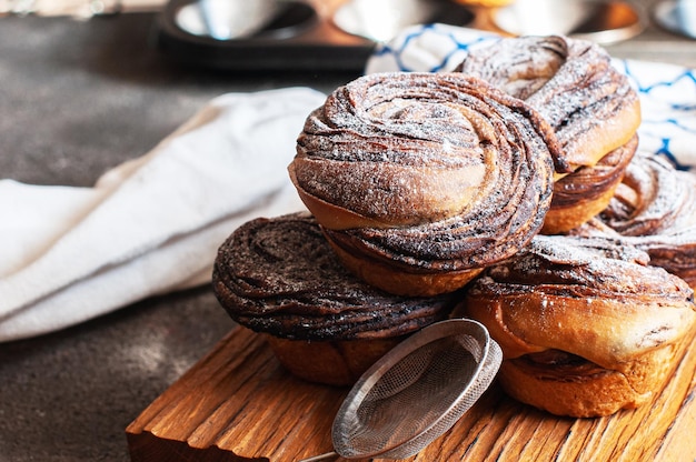 Chocolate cruffin a hybrid of a croissant and muffin with a lot of butter sprinkled with powdered sugar