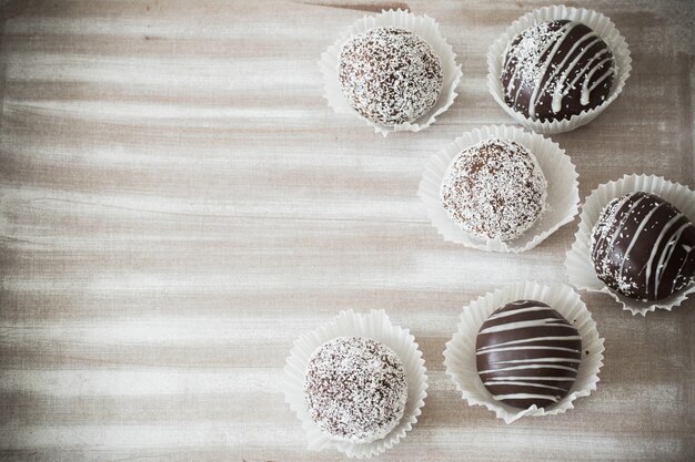 Chocolate cupcakes on a white wooden board