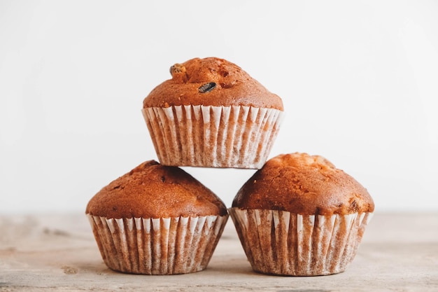 Chocolate cupcakes on wooden table background. Copy, empty space for text