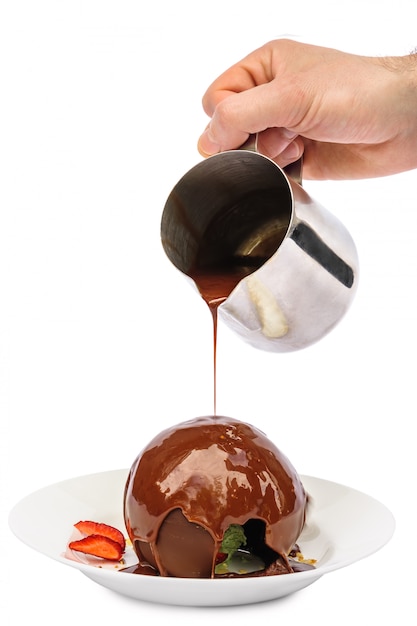 Chocolate dessert sphere with icecream and caramel