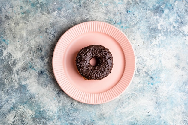 Chocolate Donut on Pink Plate