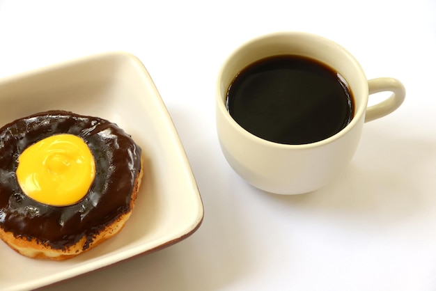 Chocolate donut with cup of coffee isolated on white background