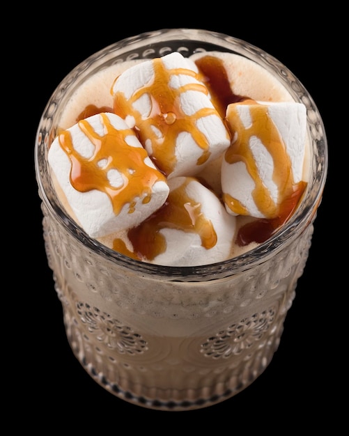 Chocolate drink with marshmallow and caramel sauce on a black Closeup