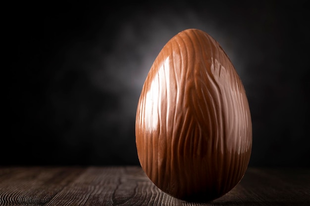 Chocolate easter egg on dark background