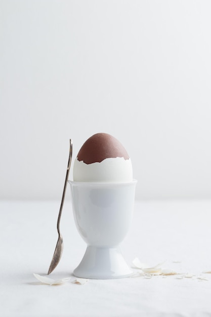 Chocolate egg on white eggstand holder