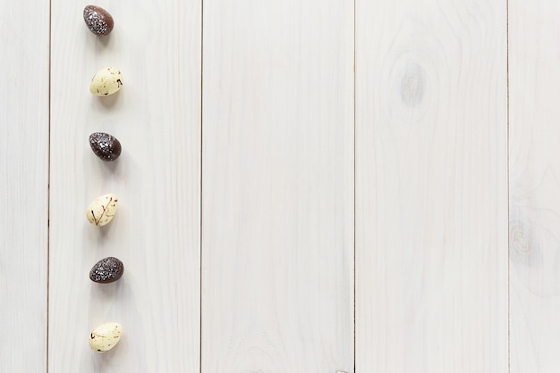 Chocolate eggs on a wooden table Easter concept Horizontal orientation top view copy space