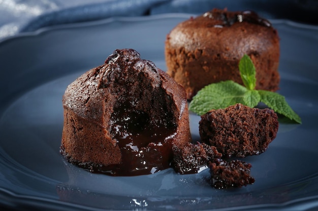 Chocolate fondant with mint on plate