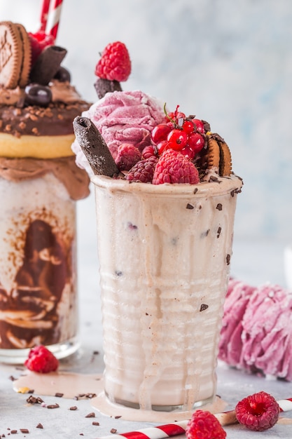 Chocolate frosting milkshake with donut and sweets