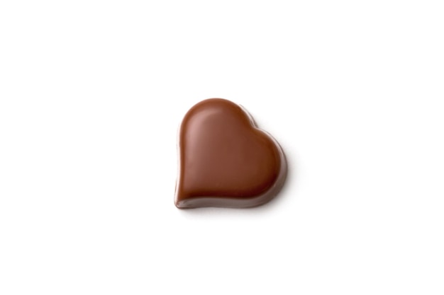 Chocolate heart-shaped candy on white background, Saint Valentine day