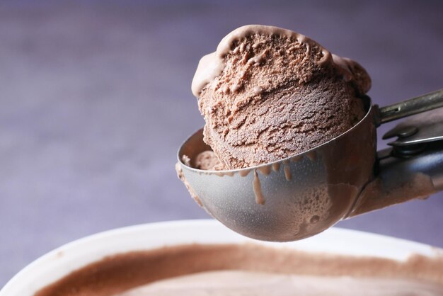 Chocolate ice cream scoop isolated on black background